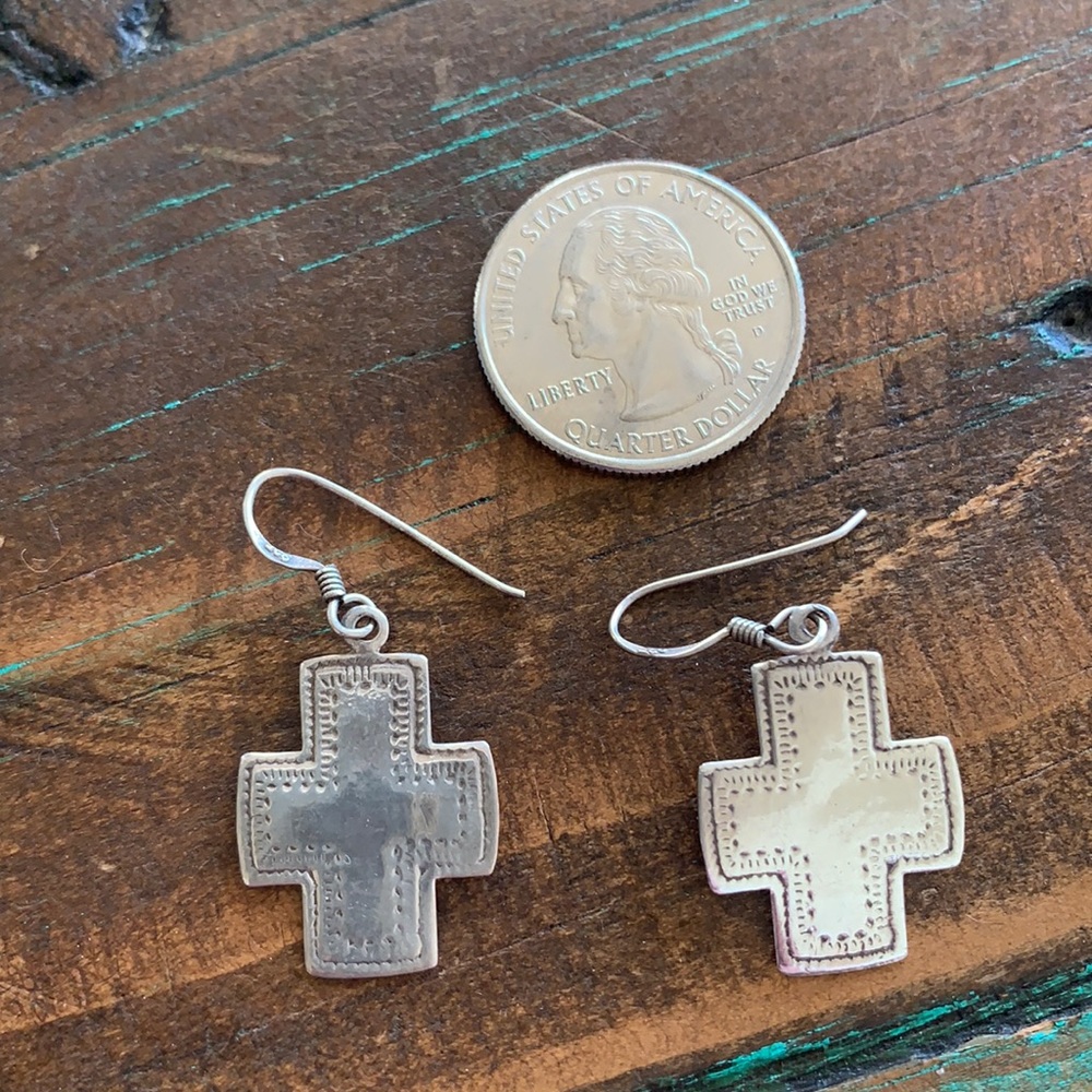 Stamped silver crosses on wire hook